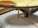 a table with a marble top and a gold base