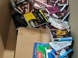 a cardboard box filled with books and other items