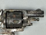 an old gun that is sitting on a table