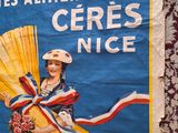 a poster of a woman holding a fan on the side of a building
