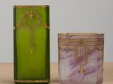 purple and green glass candle holder with a cross on the front