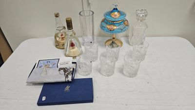 a table with a book, vases, and other items on it