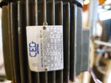 an image of a close up of a motor with a tag on it
