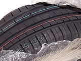 a tire that is wrapped in plastic and sitting on the ground