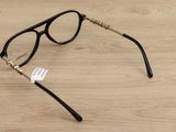 glasses on a wooden table with a tag on the side