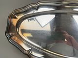 a person taking a picture of themselves in a mirror