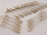 a lot of silver spoons and forks on the table