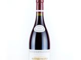 a bottle of wine that is sitting on a table