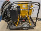 a close up of a machine with a hose attached to it