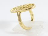 an image of a gold plated ring with a flower design on it