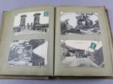 an open book with pictures of a train station and a clock tower