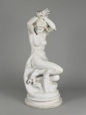 an image of a statue of a woman sitting on top of a table