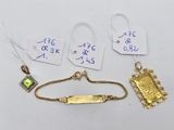 three pieces of jewelry are displayed on a table with price tags