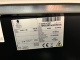 a label on the back of a dishwasher that is not in use