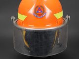 an orange hard hat with a safety helmet on top of it
