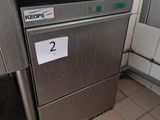 a silver dishwasher sitting in the corner of a kitchen