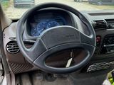 a car dashboard with a steering wheel and a dash board