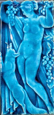 an image of a blue tile with a woman and a cat