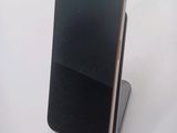 a cell phone that is sitting on top of a stand