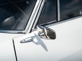 a close up of a car door handle with a mirror