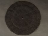 a picture of a black plate on a white table