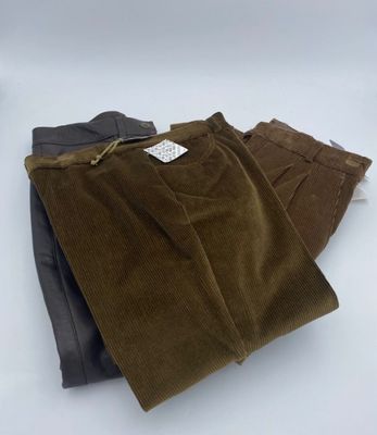 three pairs of cordurope pants sitting on top of each other