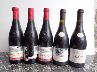 six bottles of wine are lined up on a table