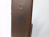 the back of a cell phone with a stand on top of it