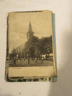 an old photo of a church with a steeple on the top of it