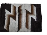 a close up of a rug with a design on it