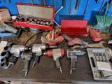 many tools that are sitting on a workbench