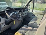 a car that is parked in a lot with the door open