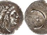 a silver coin with an image of a woman on it