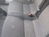 a seat in the back of a car with a seat belt