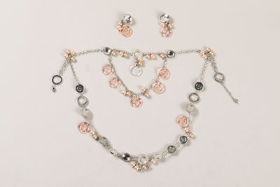 necklace and earring set in silver and rose gold tone