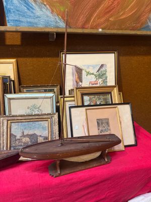 a table with a red table cloth and a bunch of pictures on it