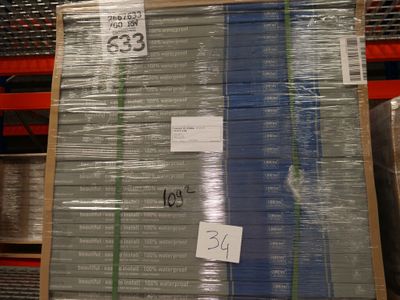 a large stack of boxes with a price tag on them