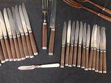 a lot of knives and knives that are on the table