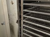 a dirty room with a bunch of racks in it