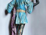 statue of a man holding a lit candle in his right hand