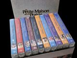 a box of dvd ' s sitting on a black surface