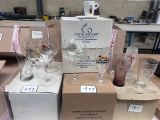 boxes of wine glasses and glasses are stacked on top of each other