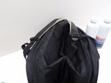 a black bag with a bottle of water in it