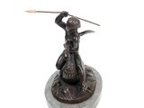 bronze statue of a woman with a spear on a stone base