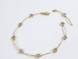 a gold and diamond bracelet