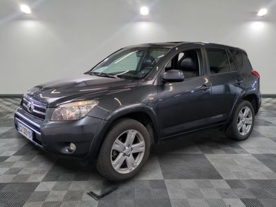 the gray toyota rav is parked in a large room
