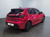 the rear end of a red toyota corollant parked in a room