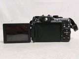 a camera that is sitting next to a monitor