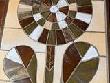 a stained glass table with a flower design on it