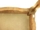a picture of a wooden frame with a piece of fabric on it